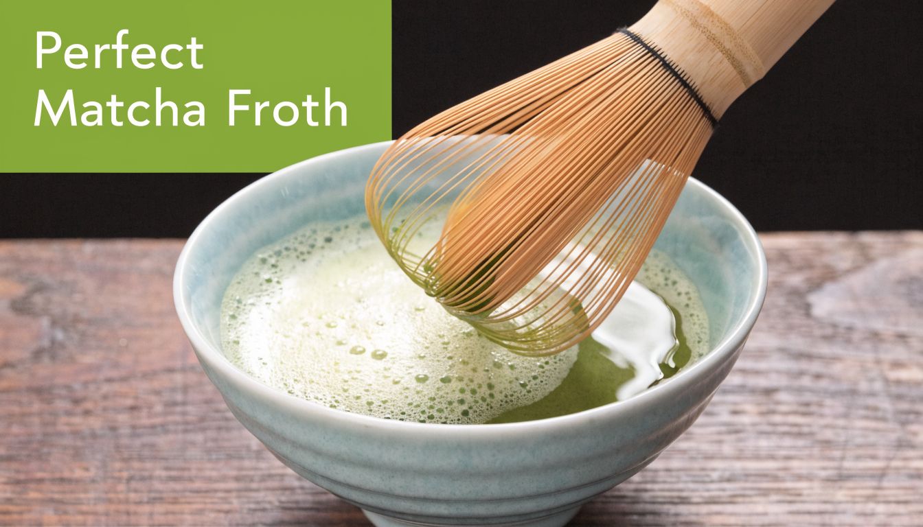 A bamboo chasen whisk stirs a vibrant green matcha tea in a light blue ceramic bowl.