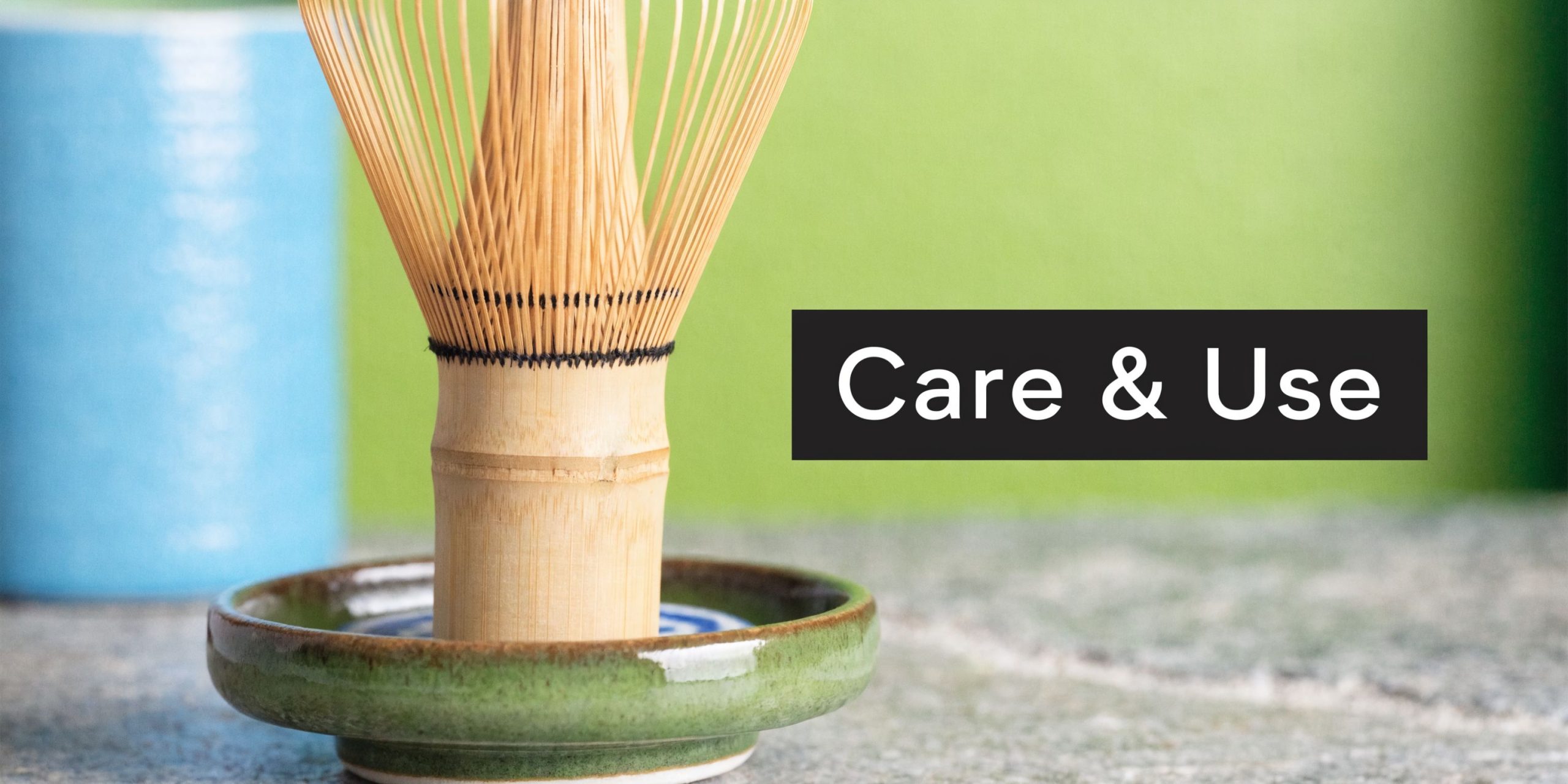 A wooden matcha whisk resting on a ceramic holder against a green background with text overlay.