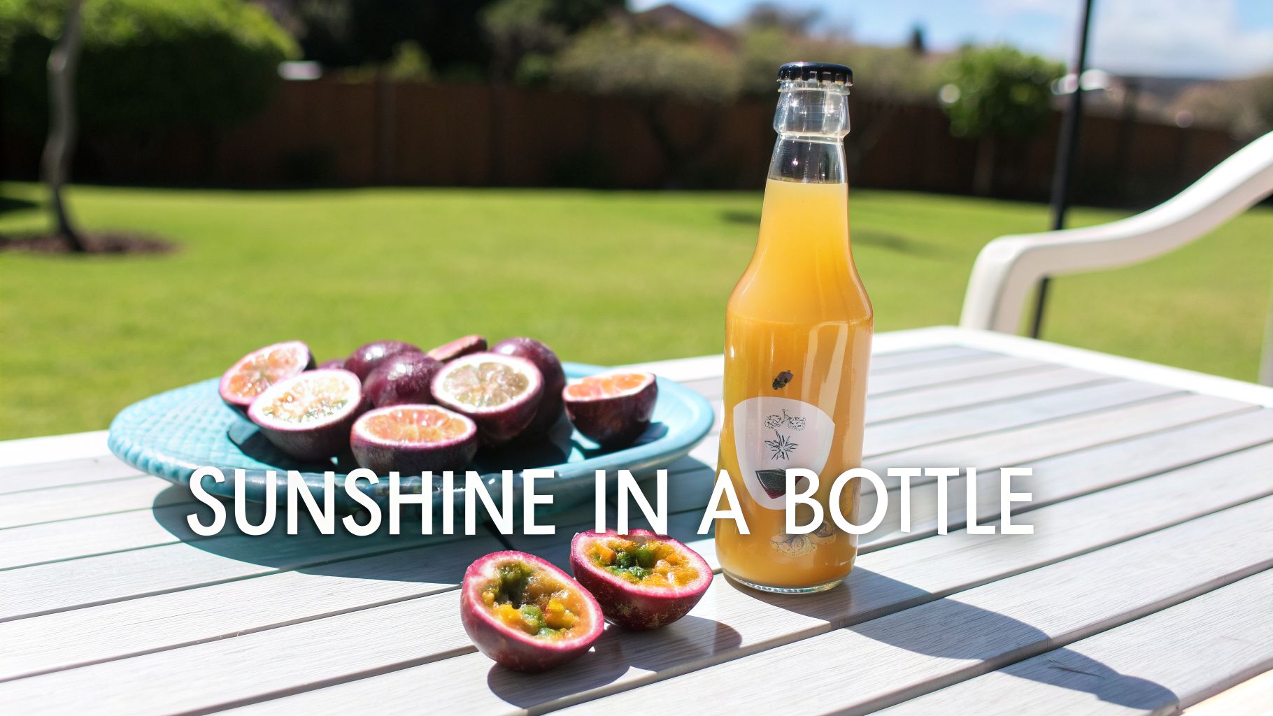 A bottle of passion fruit kombucha and fresh passion fruits on an outdoor table in the sun.
