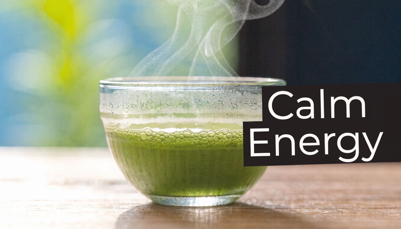 A steaming bowl of vibrant green matcha tea sits on a wooden surface with a soft background.