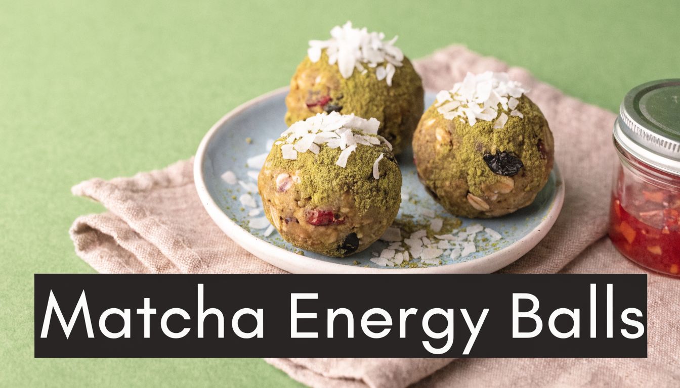 Three homemade matcha energy balls coated in coconut flakes and green tea powder on a small plate.