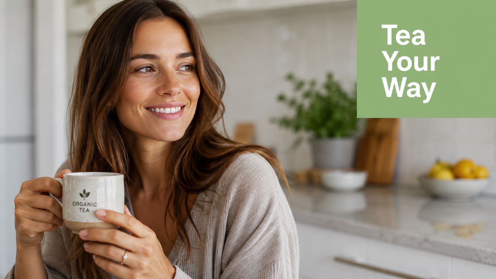 A smiling woman holding a cup of organic tea in a bright, cozy kitchen setting.
