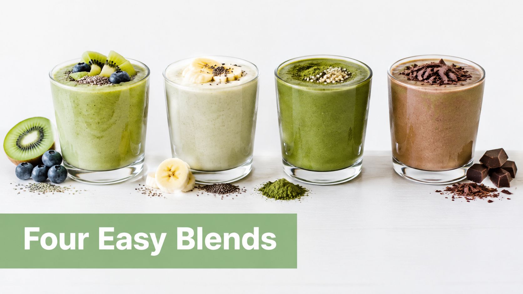 Four different colorful healthy smoothies in glasses arranged on a white table with fresh ingredients.