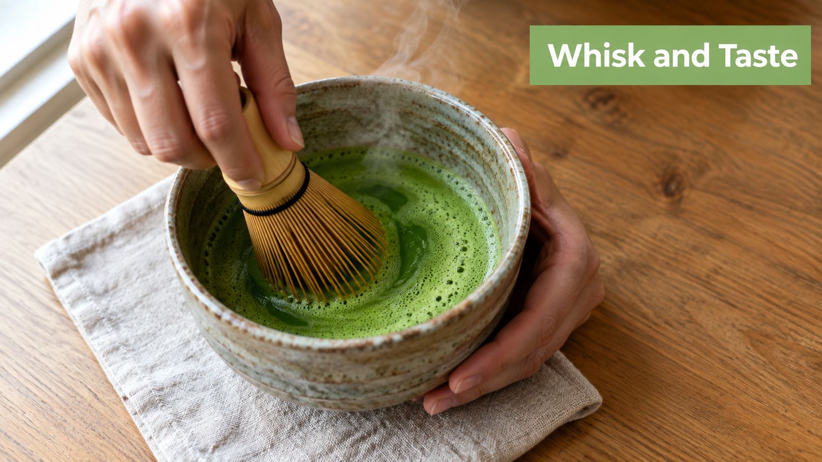 A close-up view of a person whisking ceremonial matcha tea in a traditional handmade ceramic bowl.